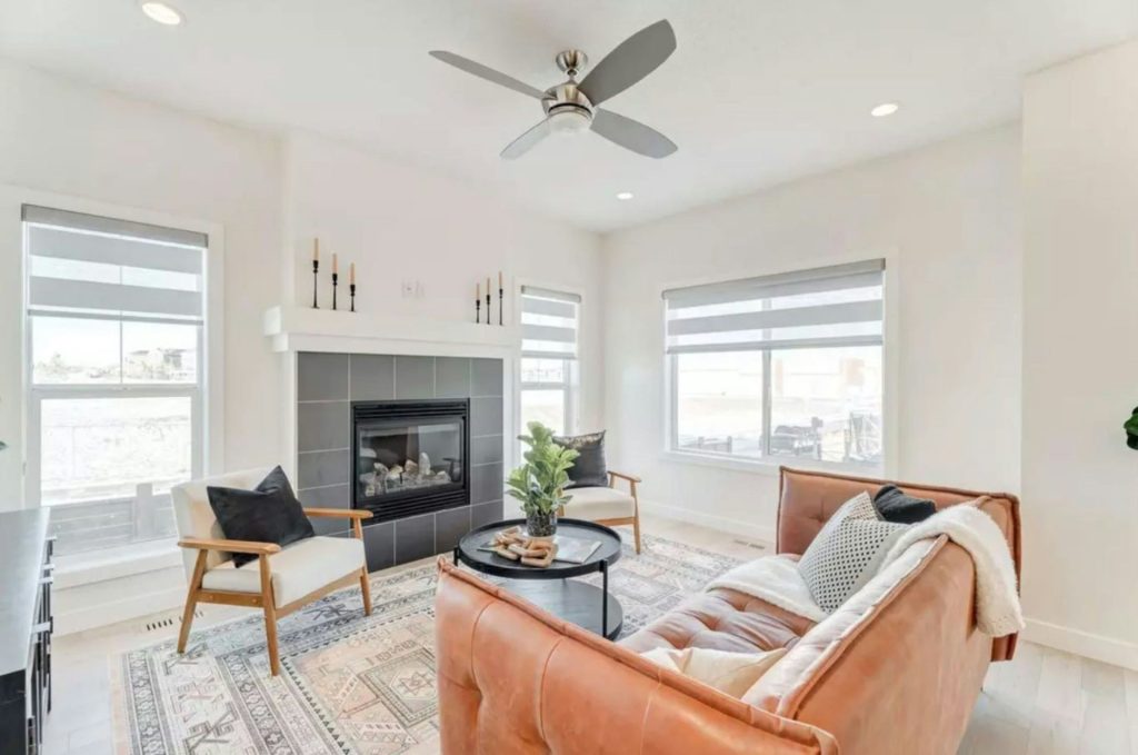 a living room filled with furniture and a fire place